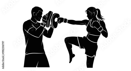 Female kickboxer practicing with a partner.