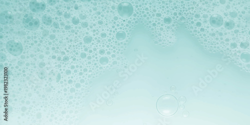 A detailed close up of soapy water foam forming abstract light blue and white circular patterns