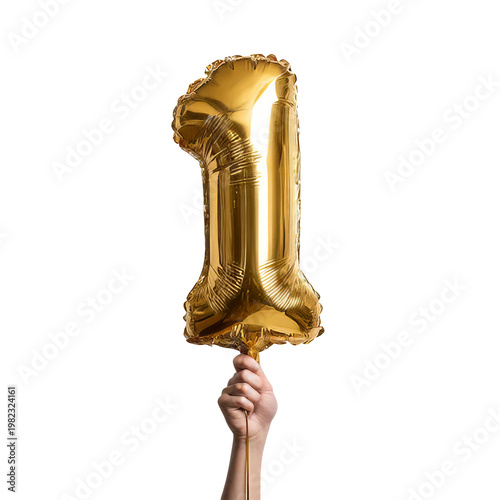 Golden balloon number one held by hand against transparent background for first birthday celebration.