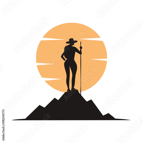 Silhouette of a hiker with a walking stick standing atop a mountain peak against a large sun or moon