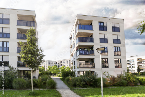 Cityscape of a residential area with modern sustainable apartment buildings, new green urban landscape in the city