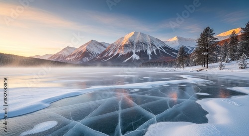 Snow covered mountains and frozen lake under a clear sky scenic landscape