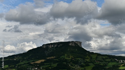 Time lapse video of the Pietra of Bismantova at sunset with a cloudy sky. Castelnuovo Monti, Reggio Emilia, Italy