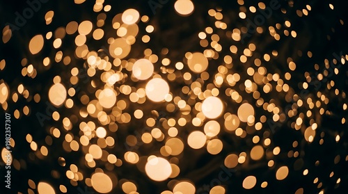 Golden light bokeh effect with numerous small and large circles on dark background