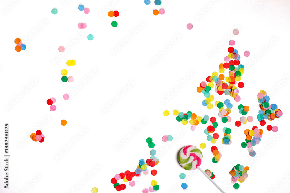 Fototapeta premium lollipop and confetti on a white background