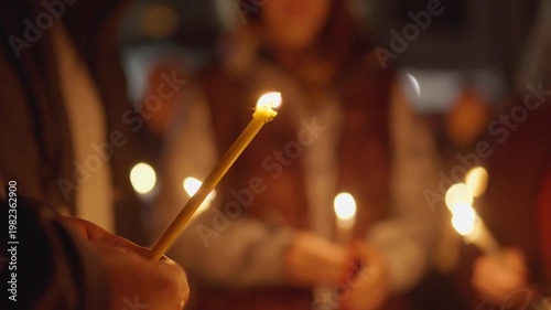 Candlelight prayer church mass gathering with people holding candles