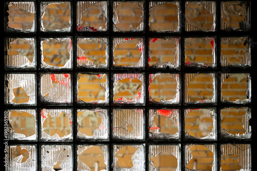 Shattered Glass Block Window Grid in Abandoned Industrial Building