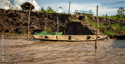 traditional flat wooden boat on the Amazon river