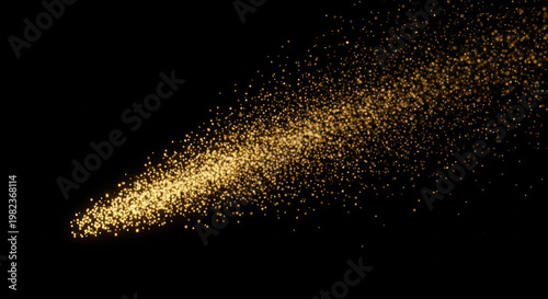 Golden glowing particles trail in darkness abstract background.