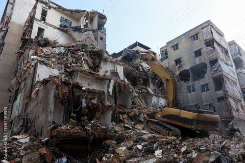 Southern Suburbs - April 10 2026: Heavy machinery work at the site of an Israeli strike carried out in southern suburbs of Beirut Lebanon showing excavation equipment clearing rubble and debris