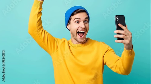 Happy man celebrating smartphone news