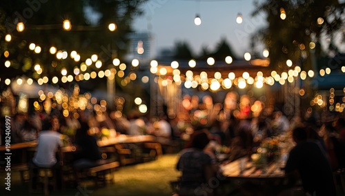 A lively outdoor gathering unfolds beneath a canopy of twinkling lights, creating a warm and inviting atmosphere for socializing and enjoyment.