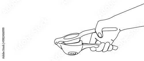 continuous line style The hand is using a lemon juicer. Minimalist vector illustration isolated on white background Editable stroke.