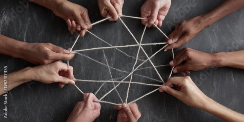 A diverse group of hands collaboratively hold and manipulate a complex web of string, symbolizing connection and interdependence.