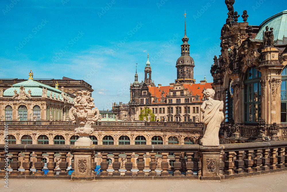 Obraz premium Historic Dresden Building Features. Ornate Facade With Sculptural Details And Domed Towers