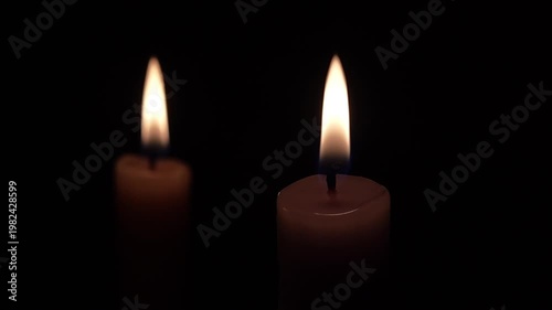 Two Burning Candles Close-Up on Black Background, Warm Flame Light, Minimal Dark Scene, Copy Space