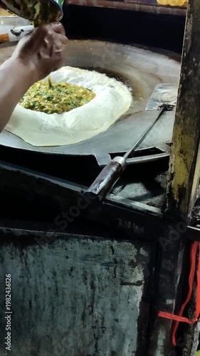 Murtabak being fried by the food seller