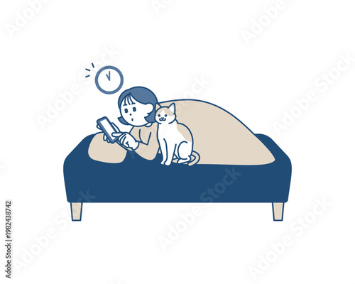 ベッドでスマホを覗き込んで夜ふかしする女性