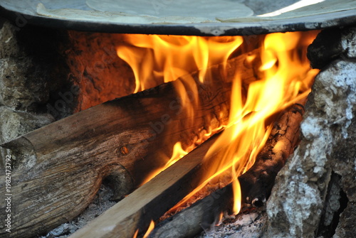 Traditional Corn Tortillas Cooking on Wood Fire Comal