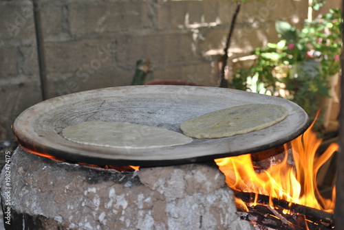 Corn Tortillas Cooking on Traditional Hot Plate