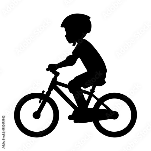 silhouette of a child riding a BMX bike with head protection and elbow protectors