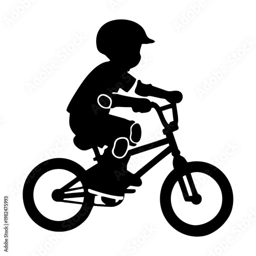 silhouette of a child riding a BMX bike with head protection and elbow protectors