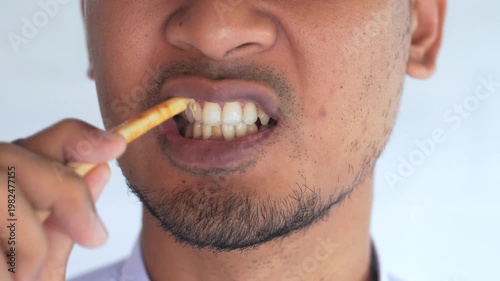 Man using miswak for traditional oral hygiene