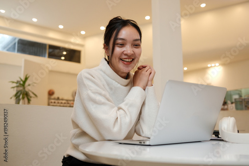 Young woman smiling while engaging in online education