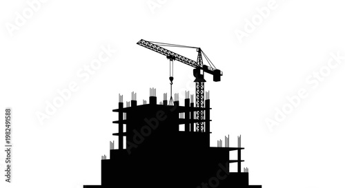 Construction site with crane silhouette.