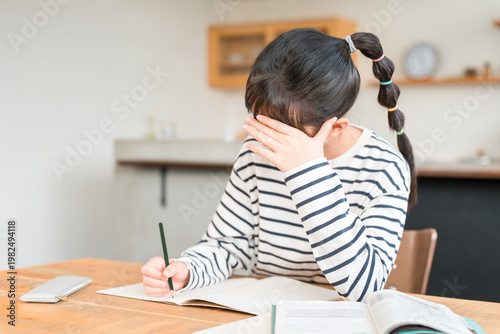 Картината върху платно Elementary, middle, and high school girls studying at home (homework, pressure,
