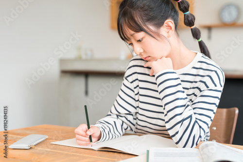 Принти на полотні Elementary, middle, and high school girls studying at home (homework, exams, stu