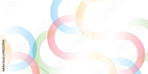 Colorful overlapping translucent rings on a white background creating a modern abstract design.