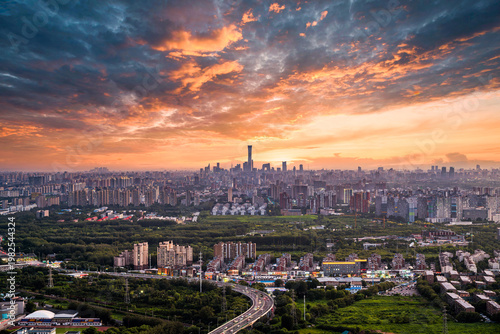Sunset view of Beijing city forest and Central Business District (CBD) skyline in one frame, China.