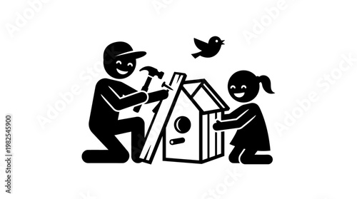 Father And Daughter Building Birdhouse Together
