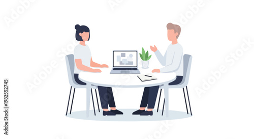 A man and a woman sit at a white round table, engaging in a professional business discussion with a laptop and a notepad in between them.