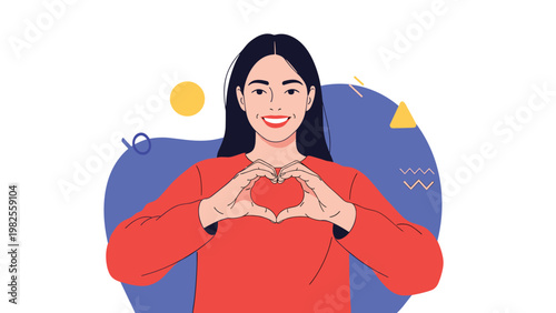 Smiling young woman making a heart shape with her hands over her chest to express love, kindness, and positivity.