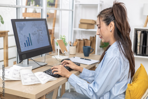 Fotografía Ecommerce, order, management, online seller types at desktop computer in home of