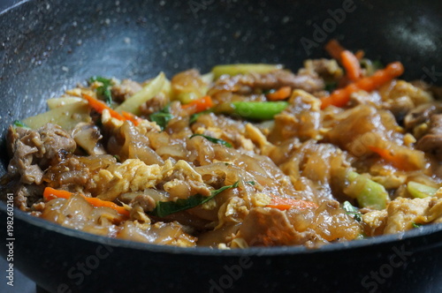 Thai Pad See Ew or Stir-fried Flat Rice Noodles with Marinated Pork and Dark Soy Sauce, Selective Focus
