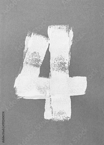 number '4'. set of numbers handmade painted with white paint roller on gray paper.