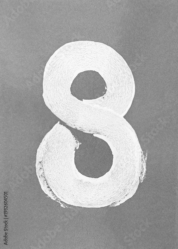 number '8'. set of numbers handmade painted with white paint roller on gray paper.