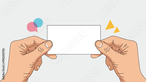 Two hands holding small rectangular white blank business card or invitation against neutral gray background for custom message and design.