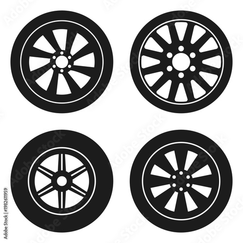 Collection of four different car wheels shown in a graphic black and white.