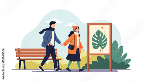 Young romantic couple walking together through a public park on a breezy day past a wooden bench and a large leaf poster for leisure time.