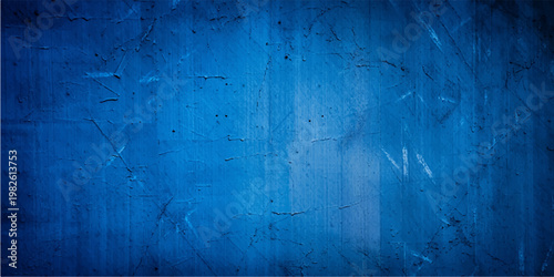 A vintage blue grunge background featuring aged wood texture and a dark painted surface with a rough weathered pattern of old concrete and antique material