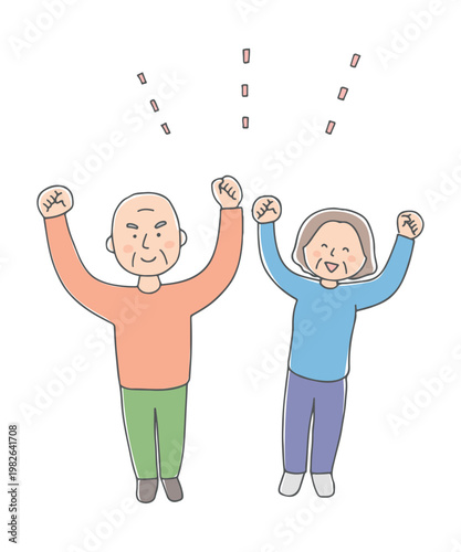 元気にガッツポーズをするシニア夫婦