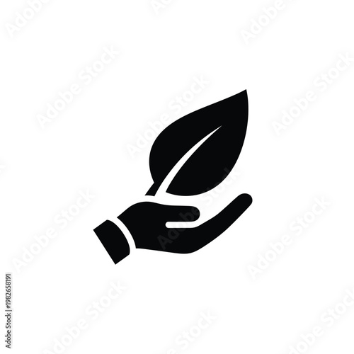 Black silhouette of hand holding a single leaf