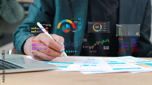 Fotografie Business analyst reviewing financial reports with digital dashboard, data visualization charts, KPI metrics and analytics