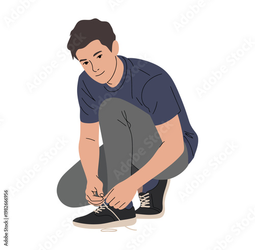 Young man ties his shoelaces on sneakers.