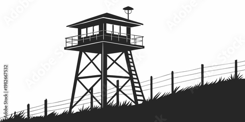Photos Silhouetted guard tower on a grassy hill with perimeter fence and overhead light