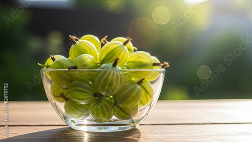 Fresh Green Gooseberries in Glass Bowl on Wooden Table with Soft Bokeh Background